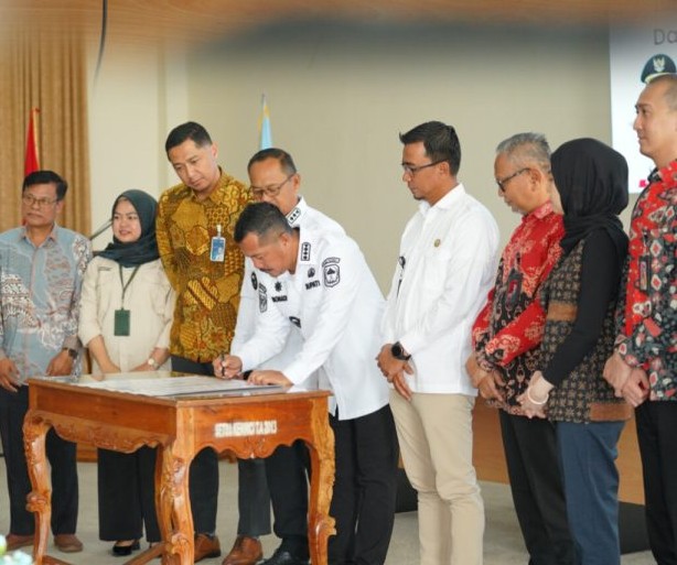 Perkuat UMKM dan Masyarakat Desa, Monadi Resmikan Rakor TPAKD Kabupaten Kerinci